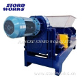 Animal waste feed processing grinder